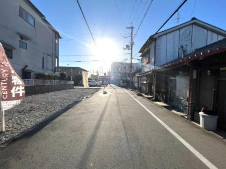 ���{�����s��c�{��2���ڂ̐V�z��ˌ��Ă̑O�ʓ��H�܂ތ��n�ʐ^