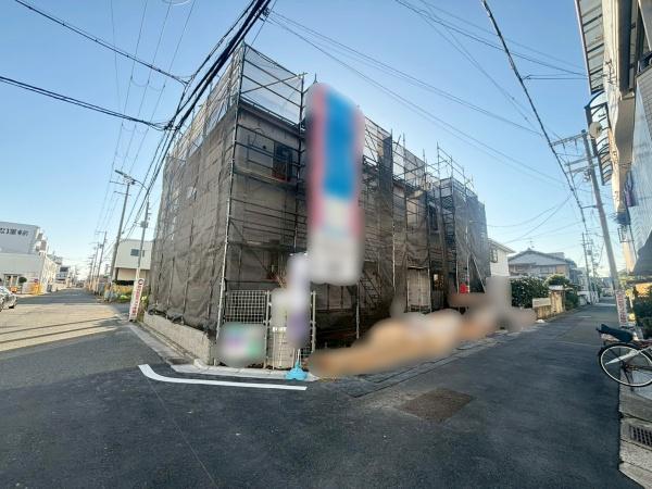 ���{�����s����2���ڂ̐V�z��ˌ��Ă̑O�ʓ��H�܂ތ��n�ʐ^