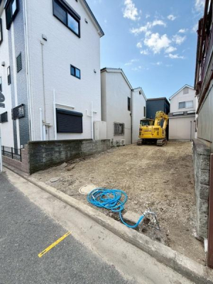 ���{��s�����̓y�n�̑O�ʓ��H�܂ތ��n�ʐ^