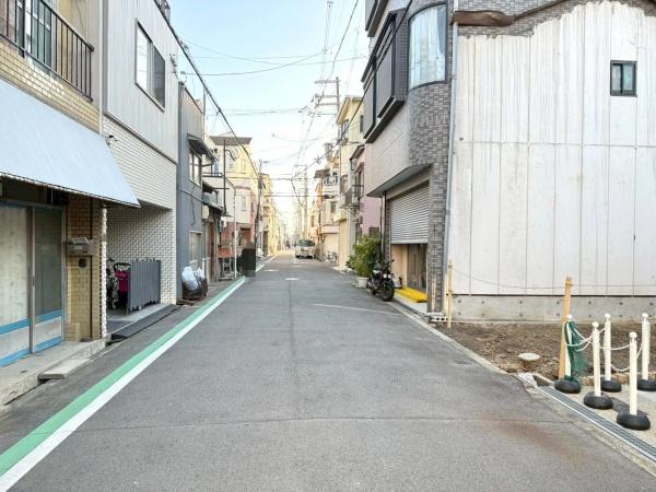 ���{���s�����c��1���ڂ̐V�z��ˌ��Ă̑O�ʓ��H�܂ތ��n�ʐ^