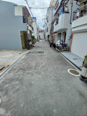 ���{�����s��@�k3���ڂ̐V�z��ˌ��Ă̑O�ʓ��H�܂ތ��n�ʐ^