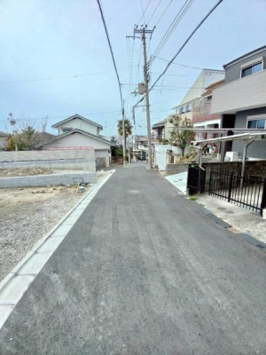 ���{�����s���ΐؒ�5���ڂ̐V�z��ˌ��Ă̑O�ʓ��H�܂ތ��n�ʐ^