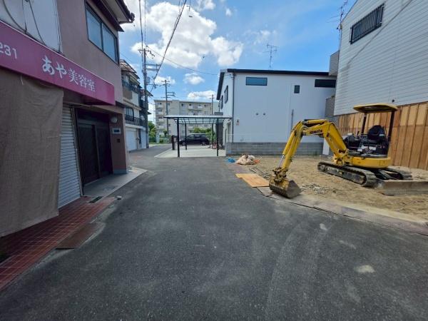 ���{��^�s��ΐ����̐V�z��ˌ��Ă̑O�ʓ��H�܂ތ��n�ʐ^