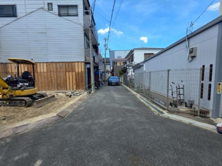 ���{��^�s��ΐ����̐V�z��ˌ��Ă̑O�ʓ��H�܂ތ��n�ʐ^