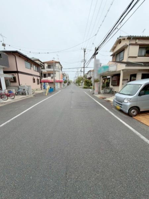 ���{�����s�썃�r��2���ڂ̐V�z��ˌ��Ă̑O�ʓ��H�܂ތ��n�ʐ^