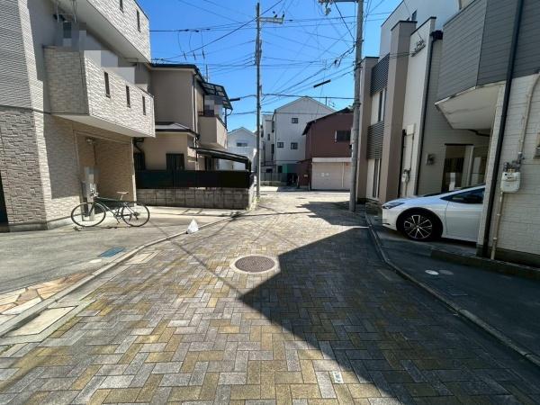 ���{����s��v�ے�4���ڂ̒��È�ˌ��Ă̑O�ʓ��H�܂ތ��n�ʐ^